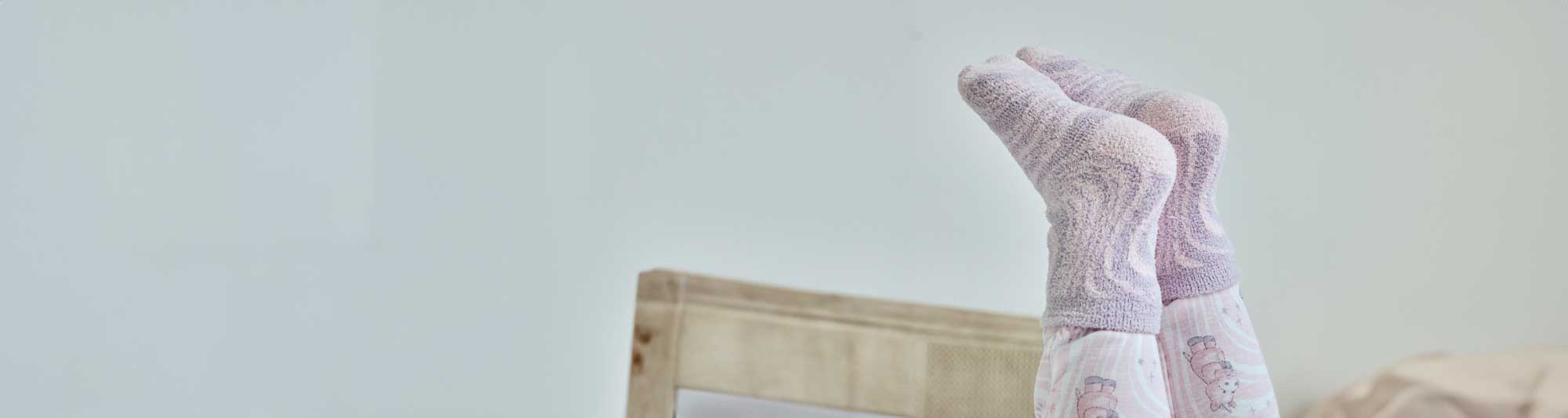 Image of a person wearing Warmies Unicorn Crew Socks.