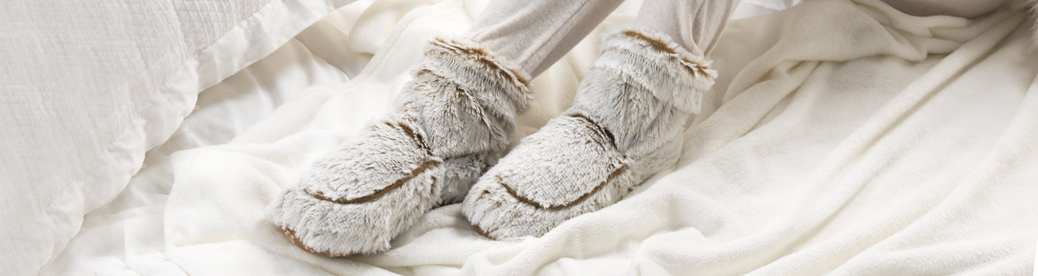 Image of a person wearing Marshmallow Brown Warmies Boots.