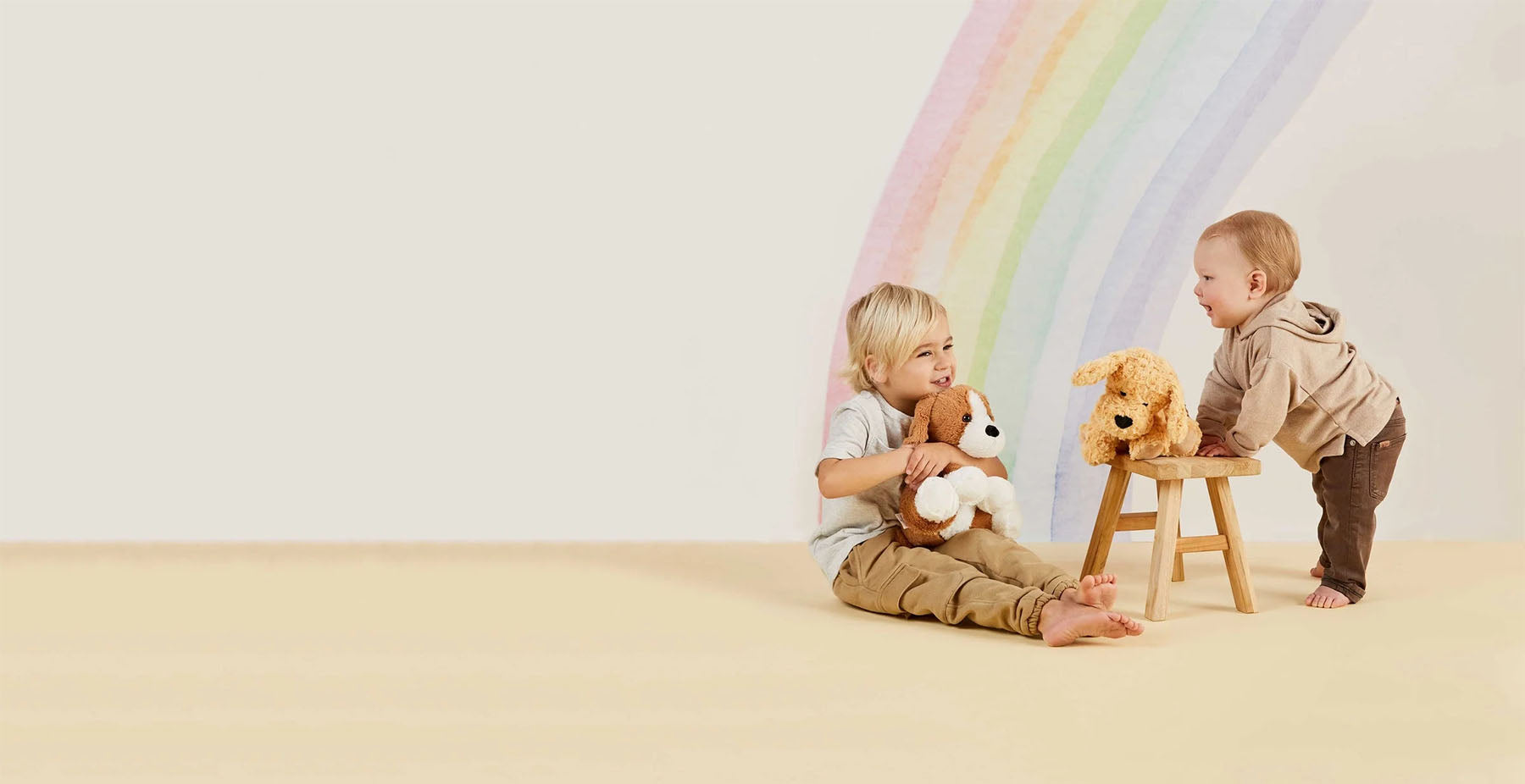 kids playing with warmies stuffed animals