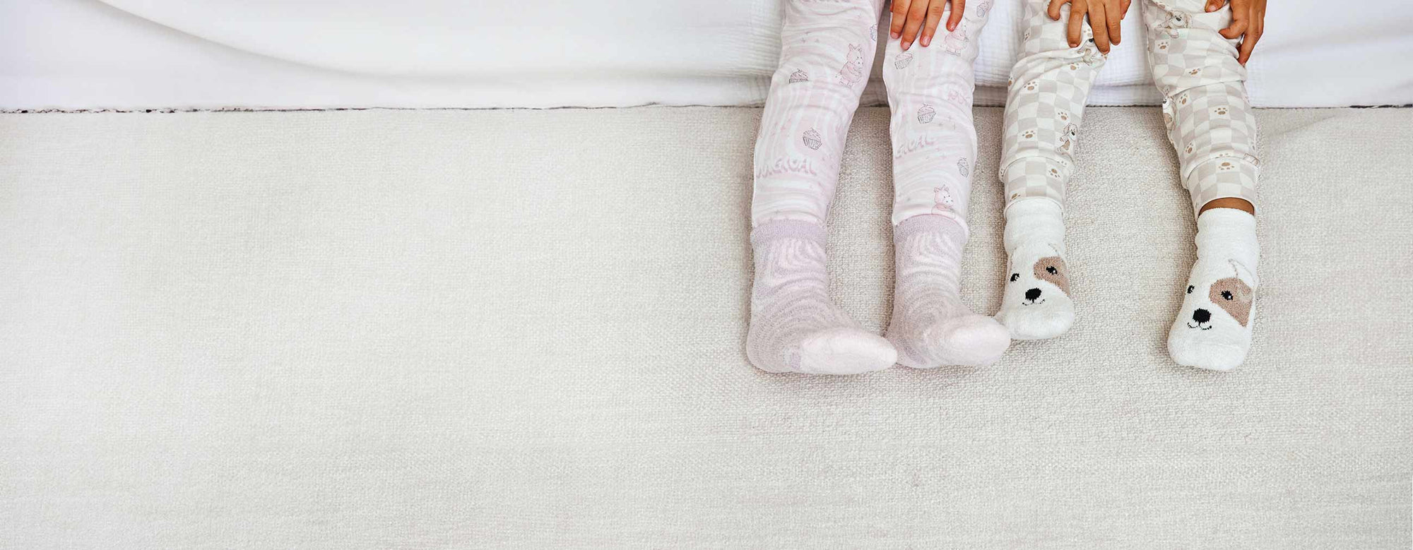 Children wearing Warmies Unicorn Crew socks and Warmies Puppy Crew Socks.