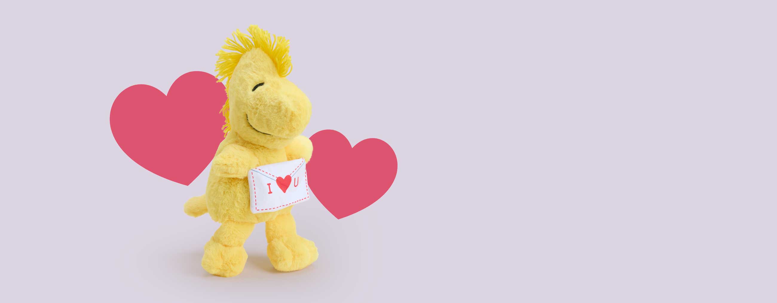 Woodstock Warmies plush holding a love letter