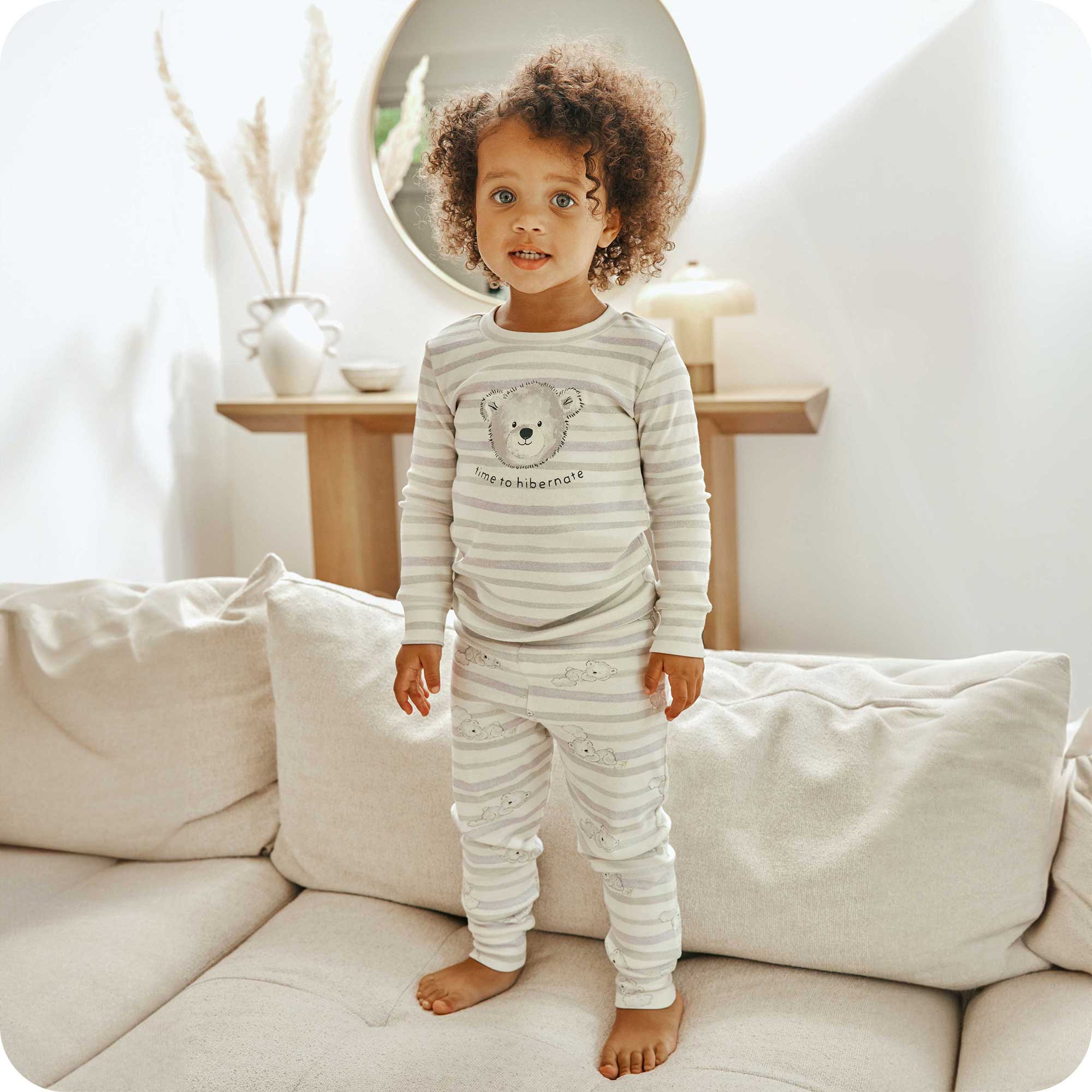 Toddler standing and wearing Marshmallow Bear Pajamas - Warmies USA