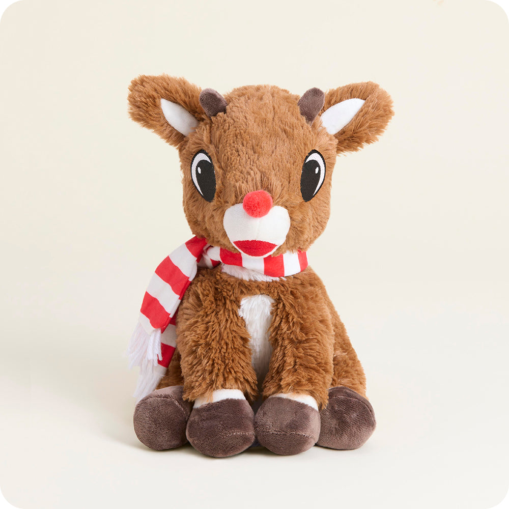 Plush reindeer toy with a red scarf on a white background