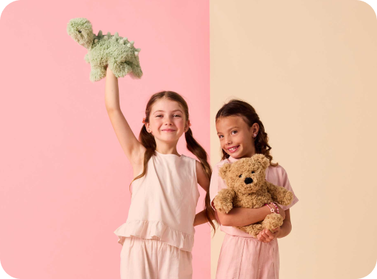 Children playing with Warmies stuffed animals.