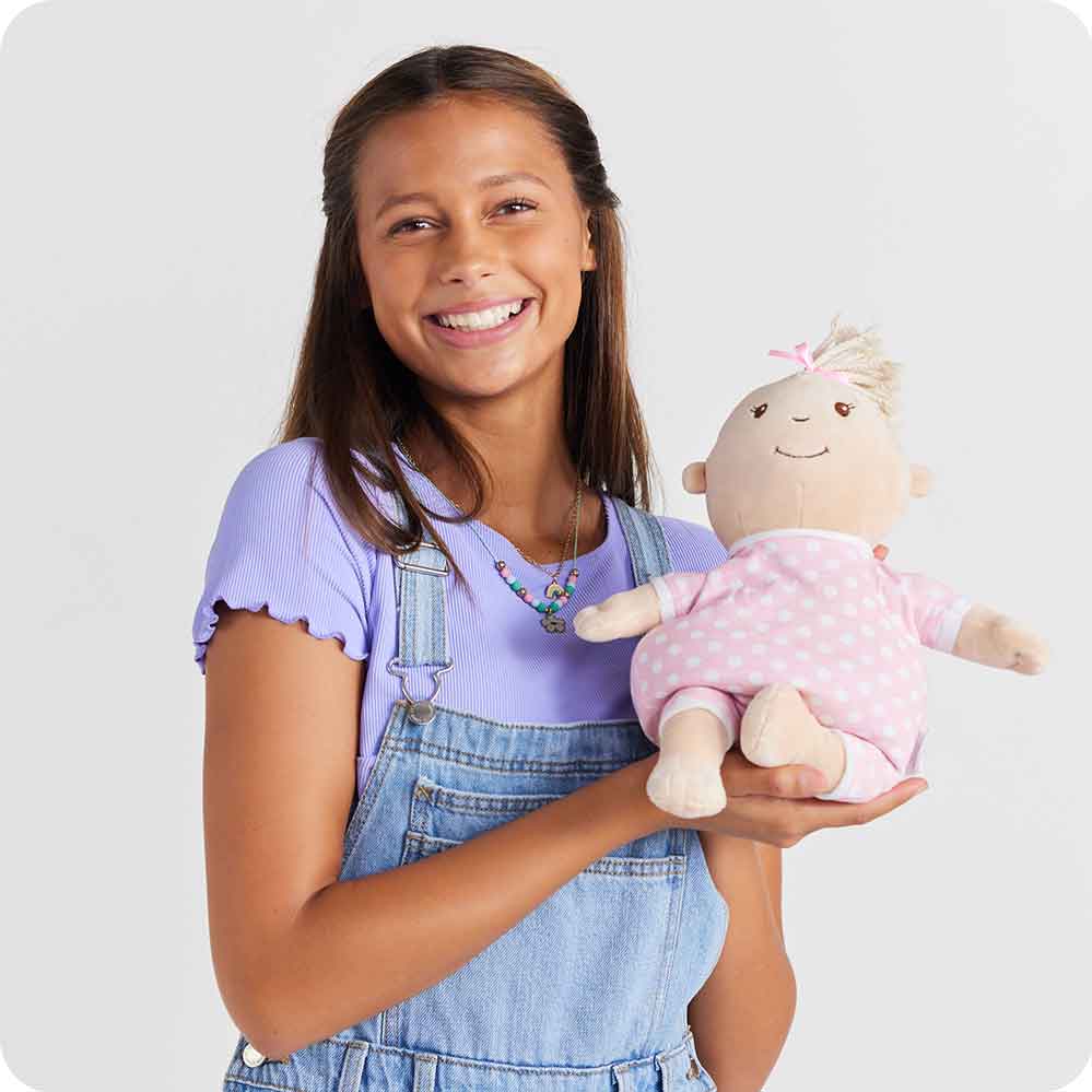 Teen holding Cute Weighted Lavender Scented Baby Girl Stuffed animal Heating Pad Warmies