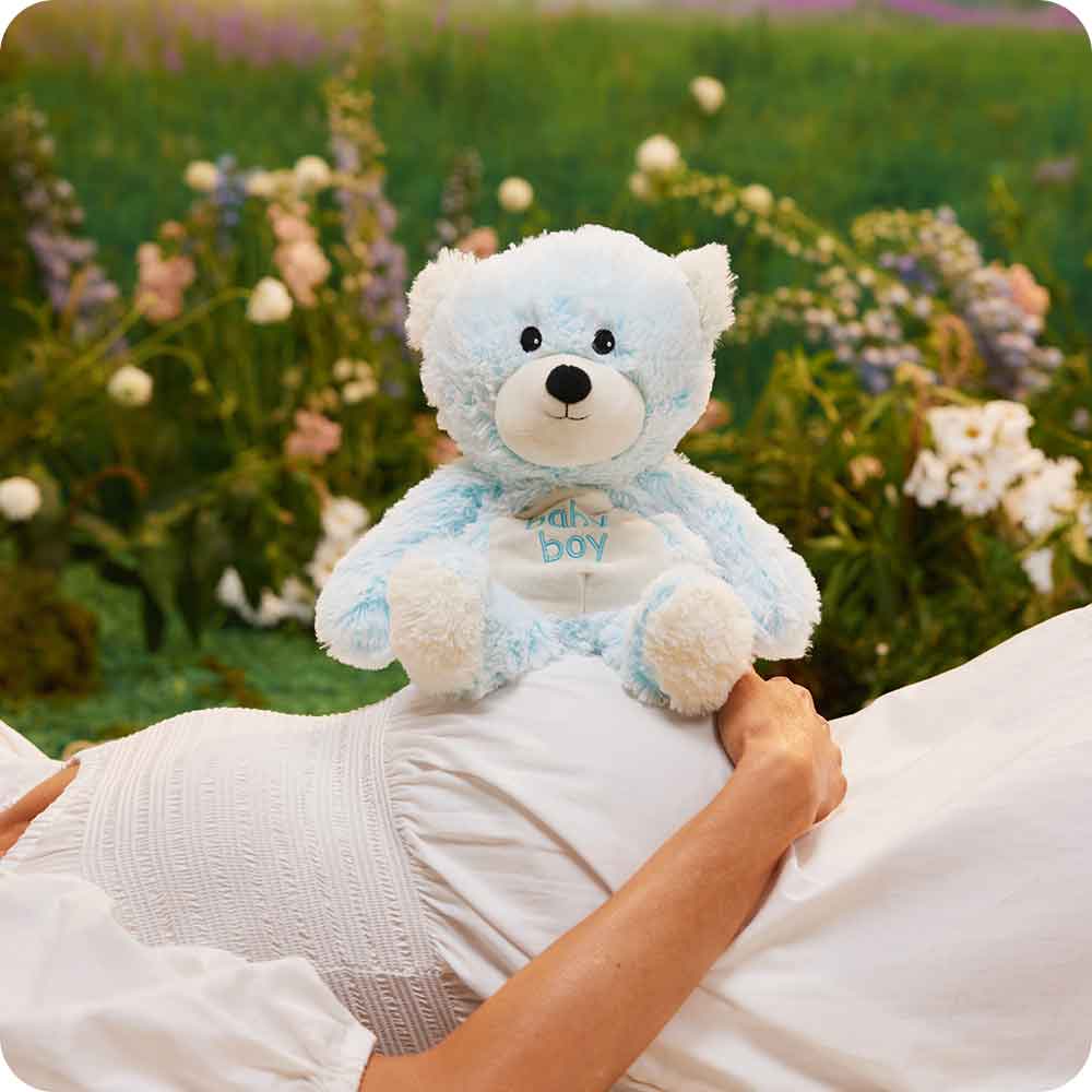 Expecting mother holding Microwavable Baby Boy Bear Warmies