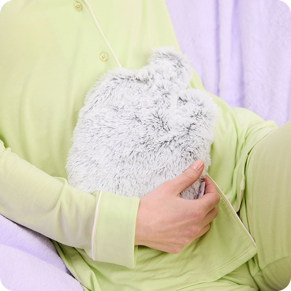 woman holding Warmies Marshmallow Gray Microwavable Bottle