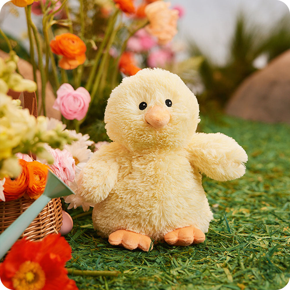 chick stuffed animal in a garden picnic setting