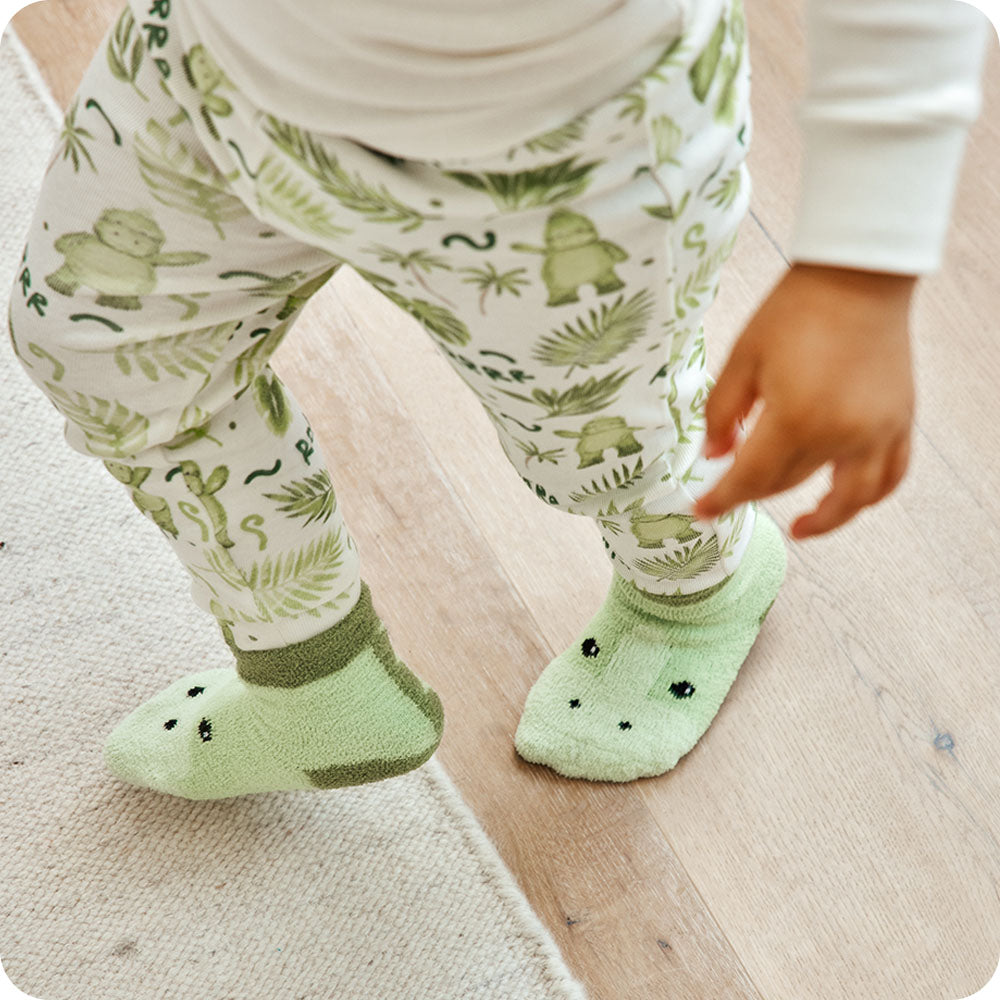 boy wearing dinosaur socks