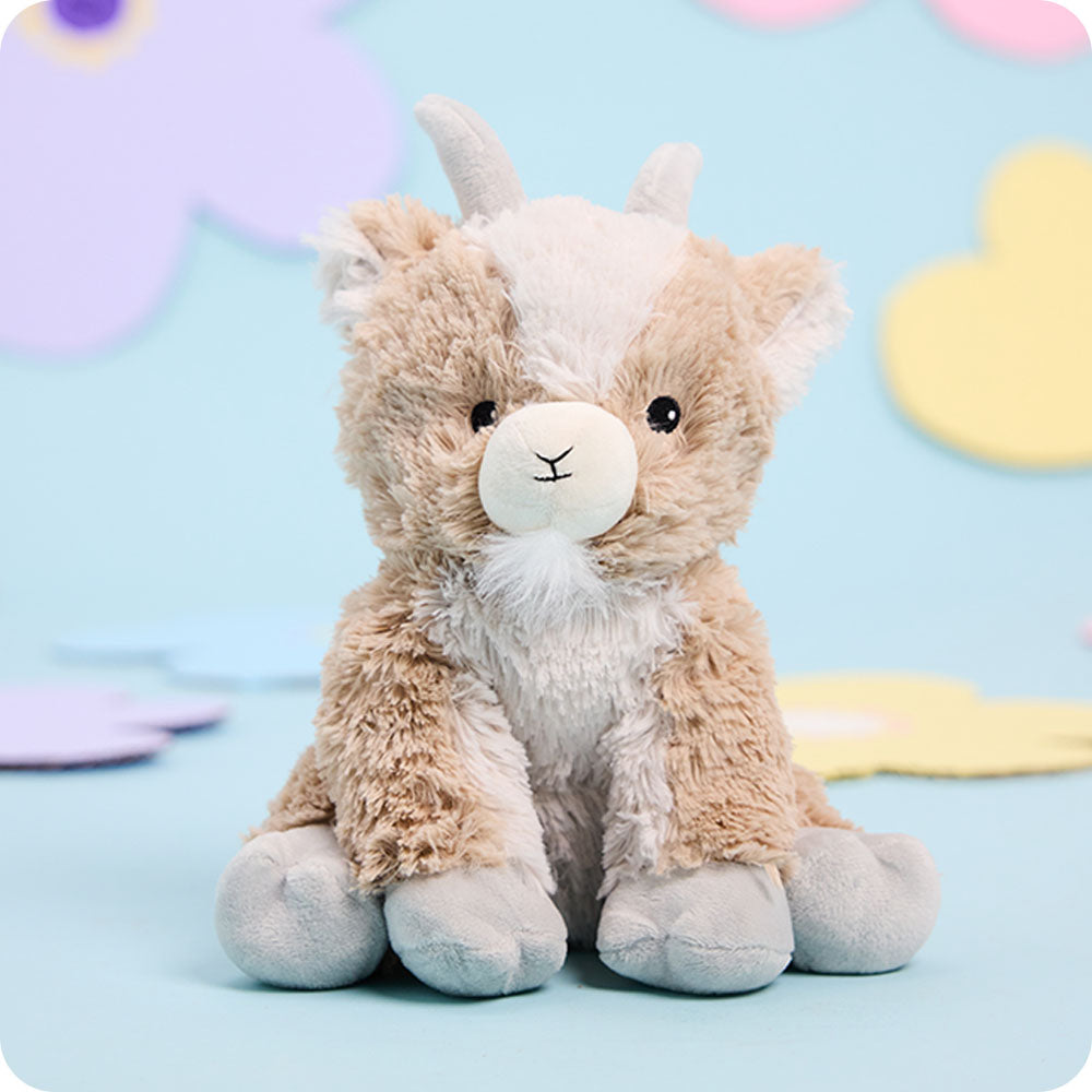 goat stuffed animal warmies on blue background