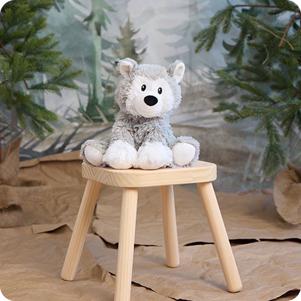 woodland scene with husky stuffed animal
