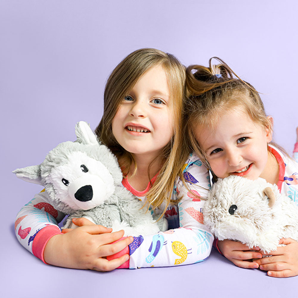 kids playing with husky stuffed animal