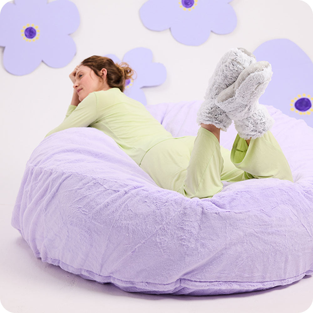 woman wearing gray warmies slipper boots