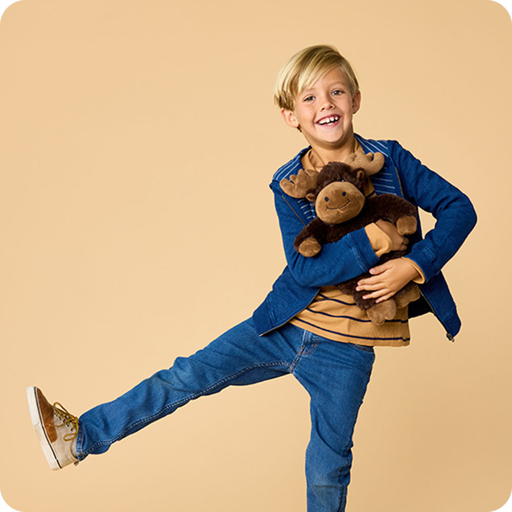 boy holding a moose stuffed animal