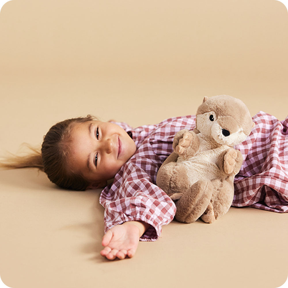 girl with otter stuffed animal