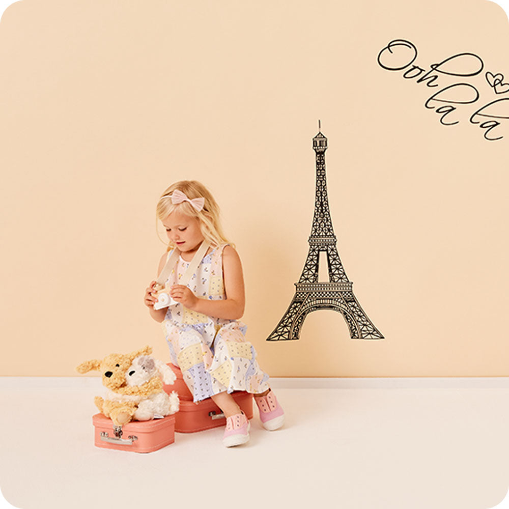 girl playing with puppy hugs warmies