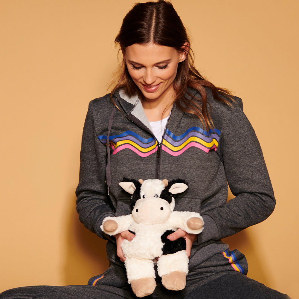 Woman holding Plush Warm Weighted Black and White Cow Warmies