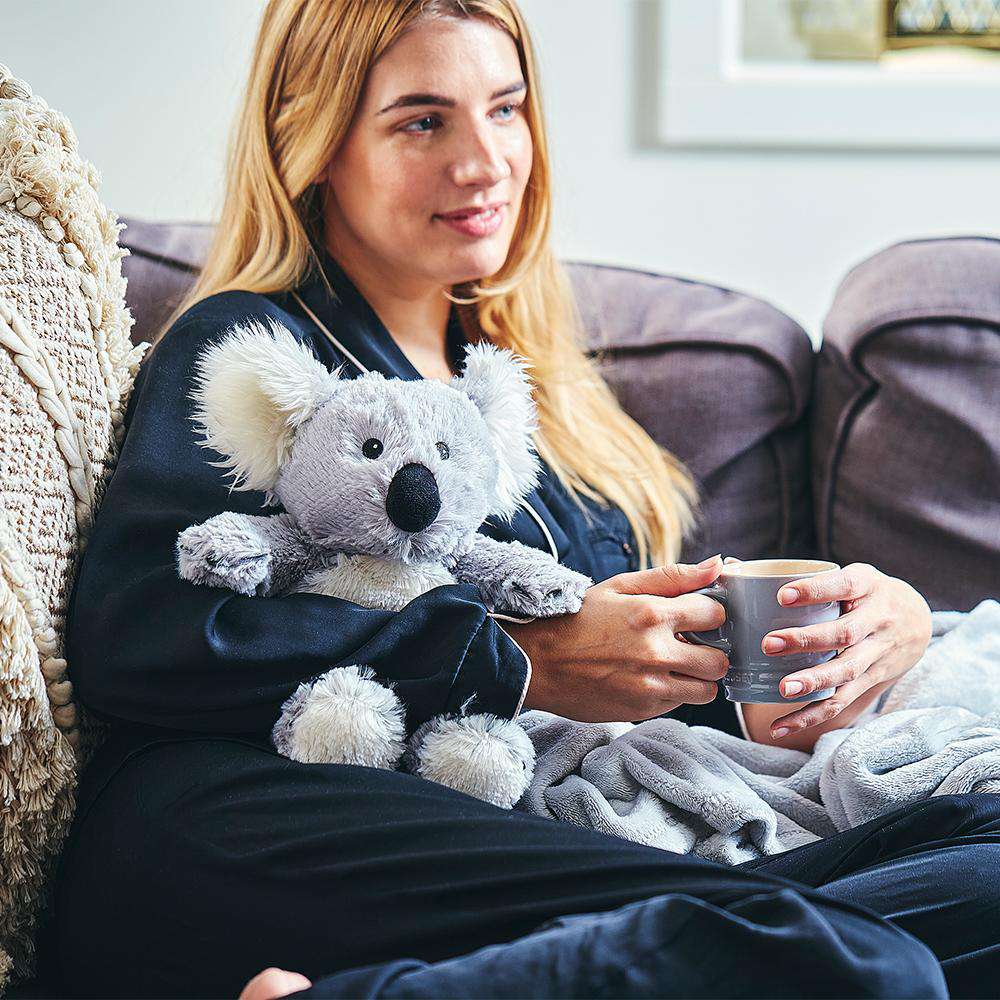 Woman hugging Cute Weighted Lavender Scented Koala Stuffed Animal Heating Pad Warmies