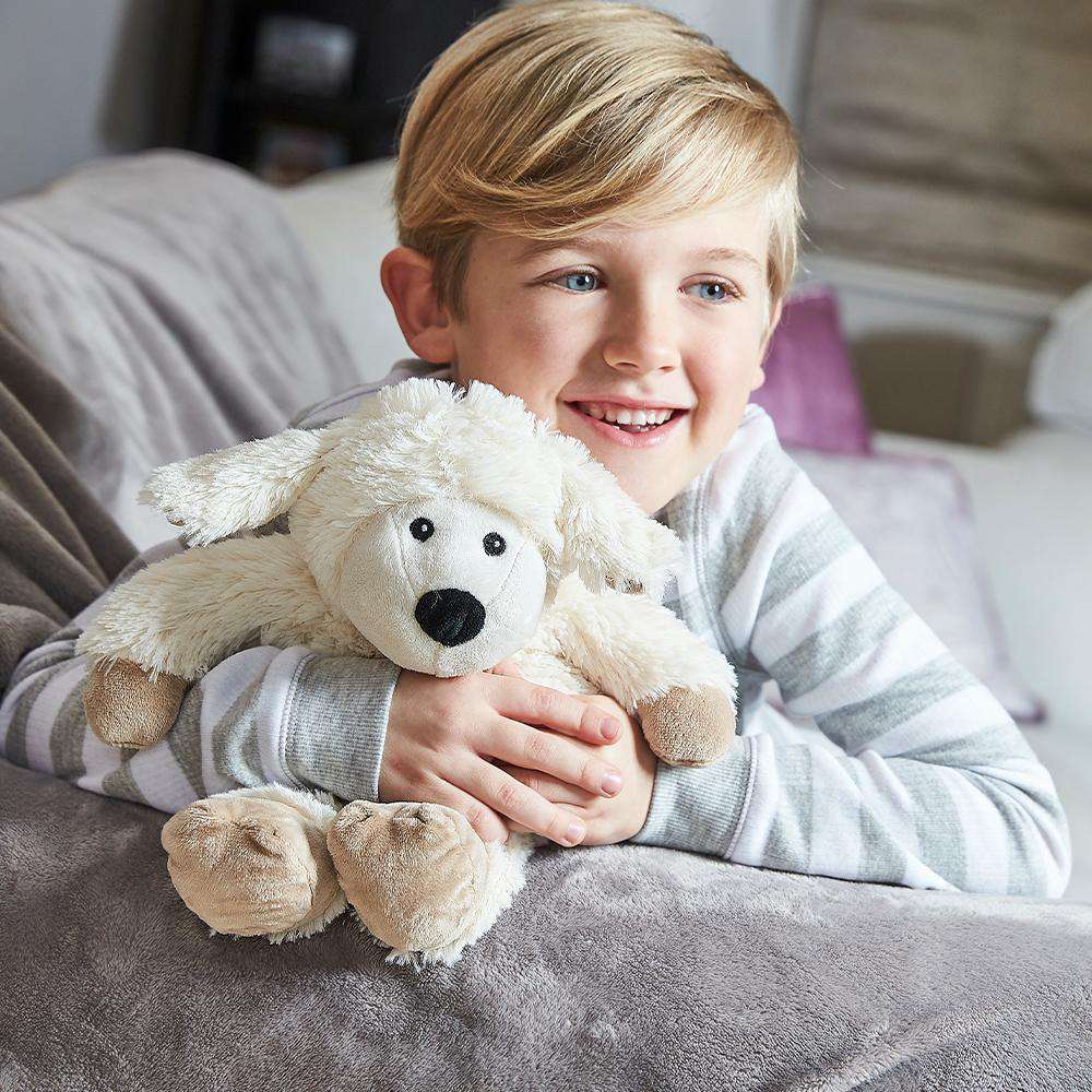 Boy hugging Heated Sheep Plush Warmies