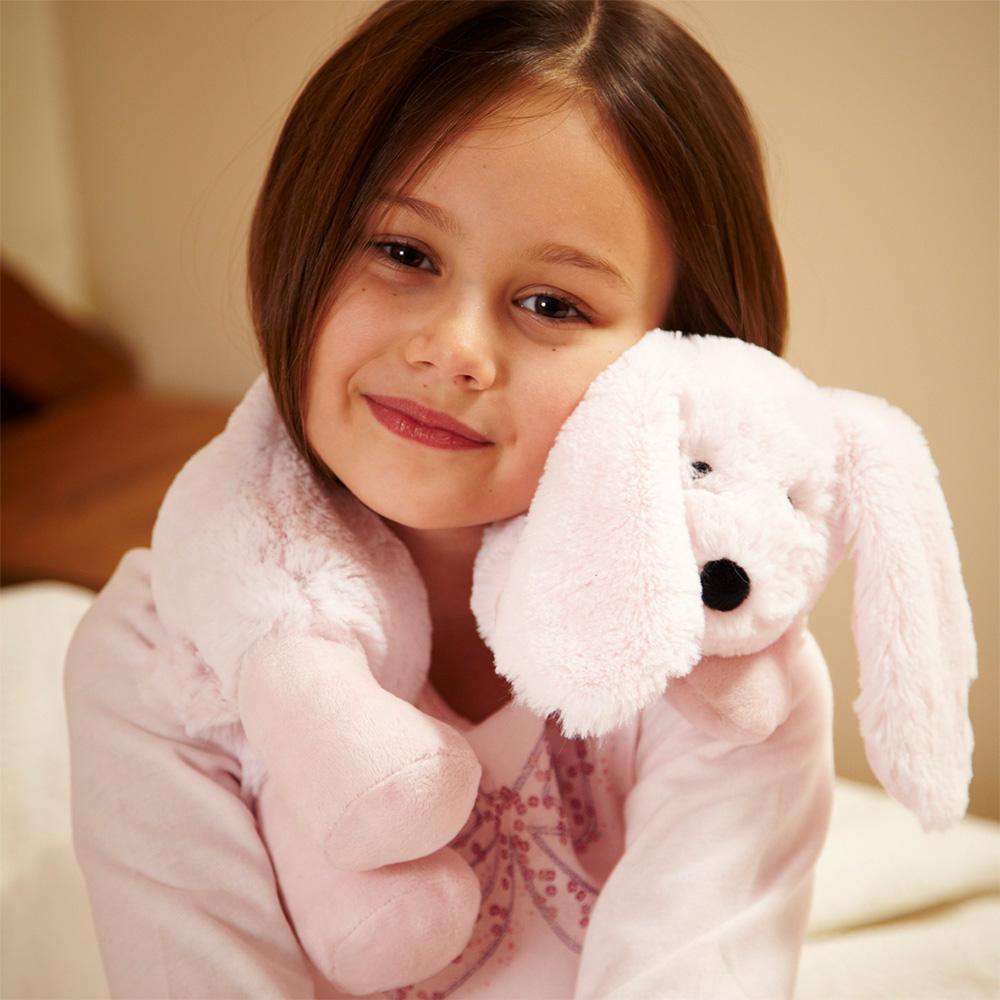 Girl snuggling Bunny Wrap Stuffed Animal Warmies