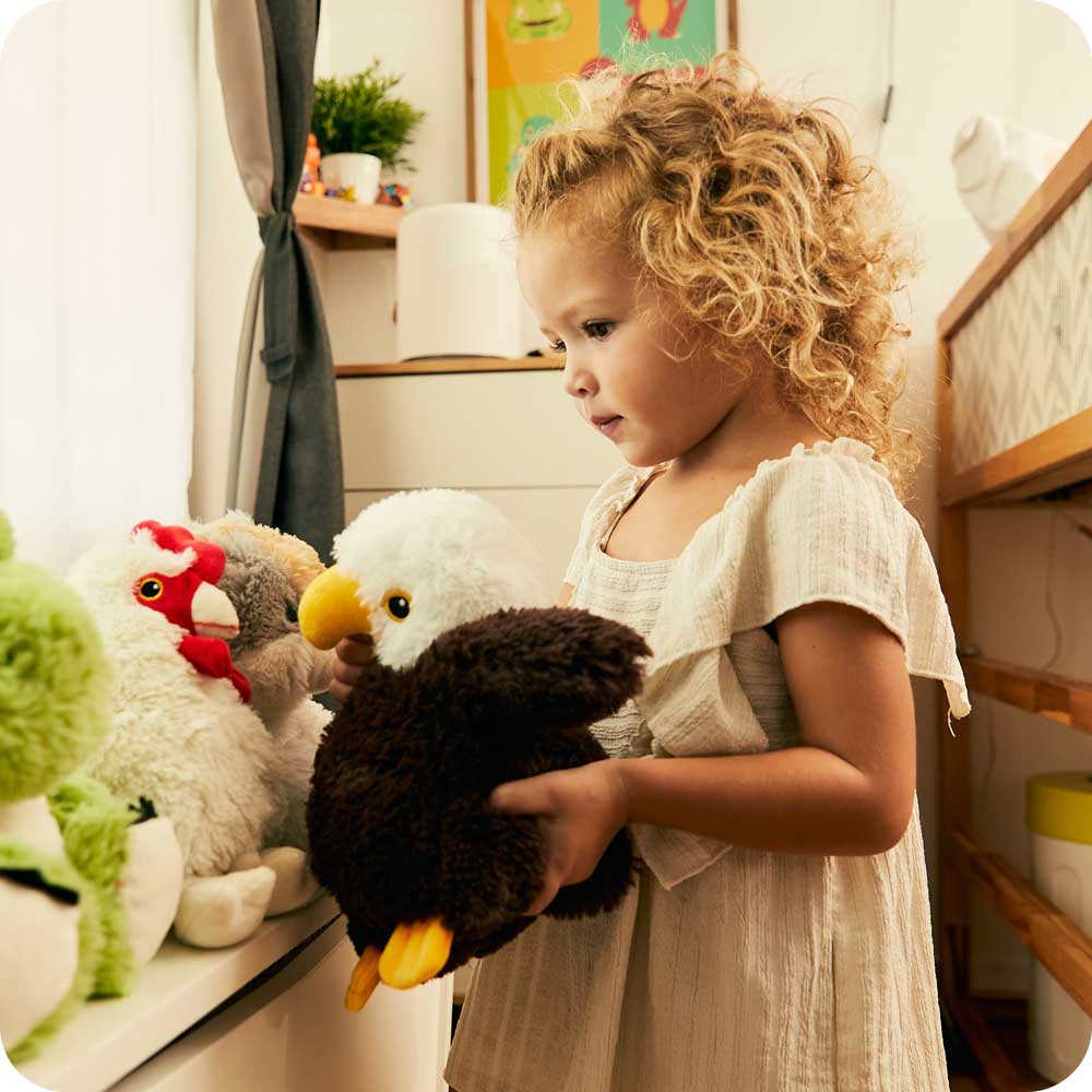 Toddler playing with Cute Weighted Lavender Scented Eagle Stuffed Animal Heating Pad Warmies
