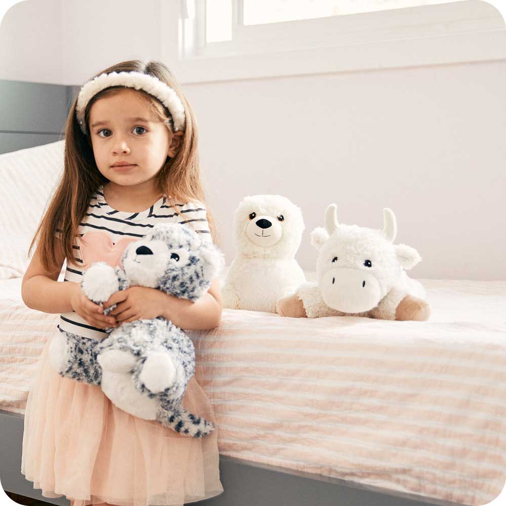 Girl holding Cute Weighted Lavender Scented Buffalo Stuffed Animal Heating Pad Warmies