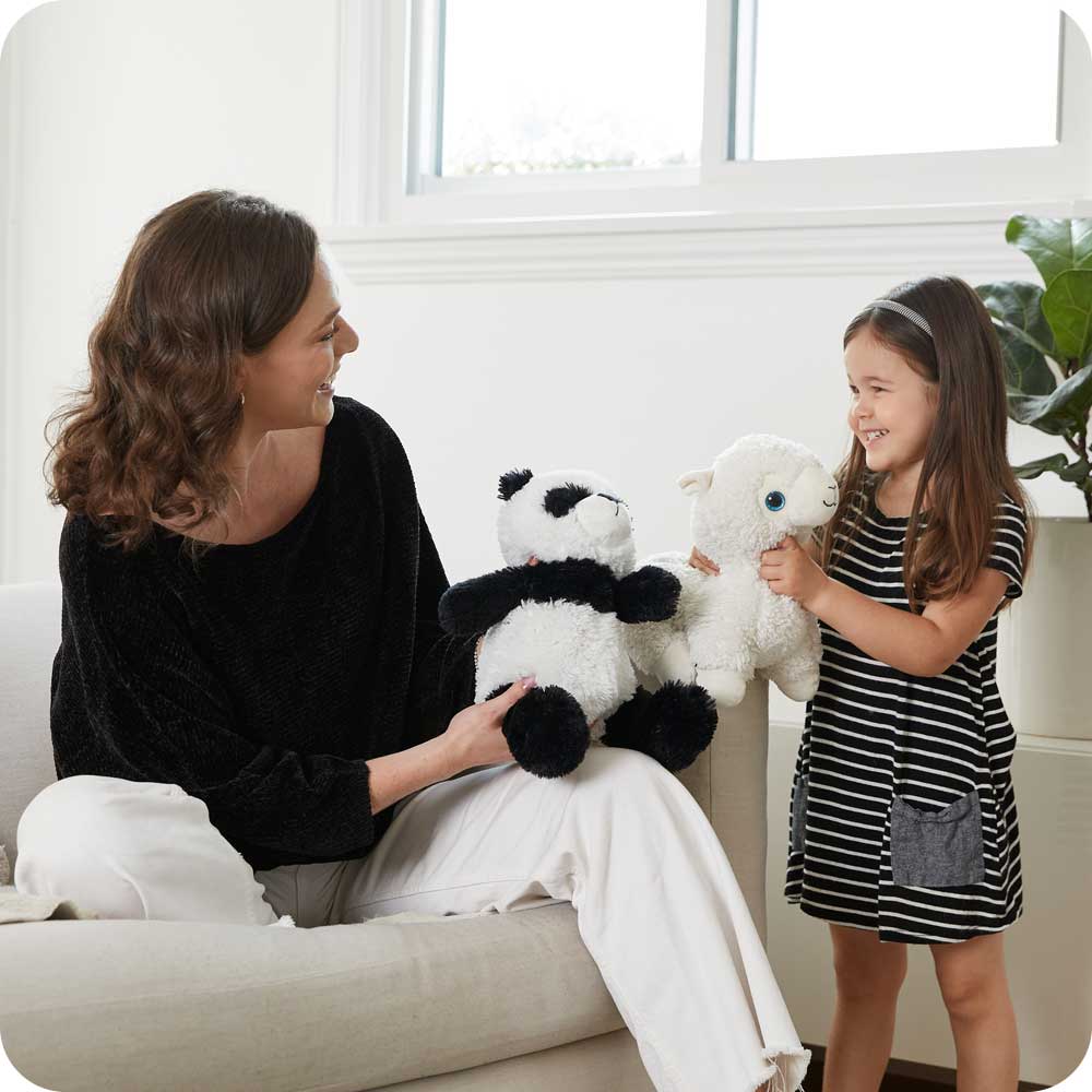 Mother and daughter playing with Soft Warm Weighted Panda Plush Warmies