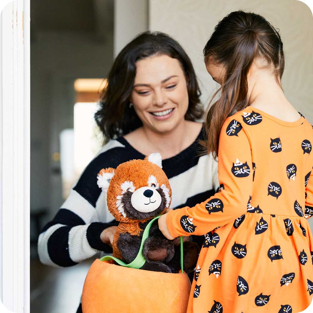 Mother giving daughter Soft Warm Weighted Red Panda Plush Warmies