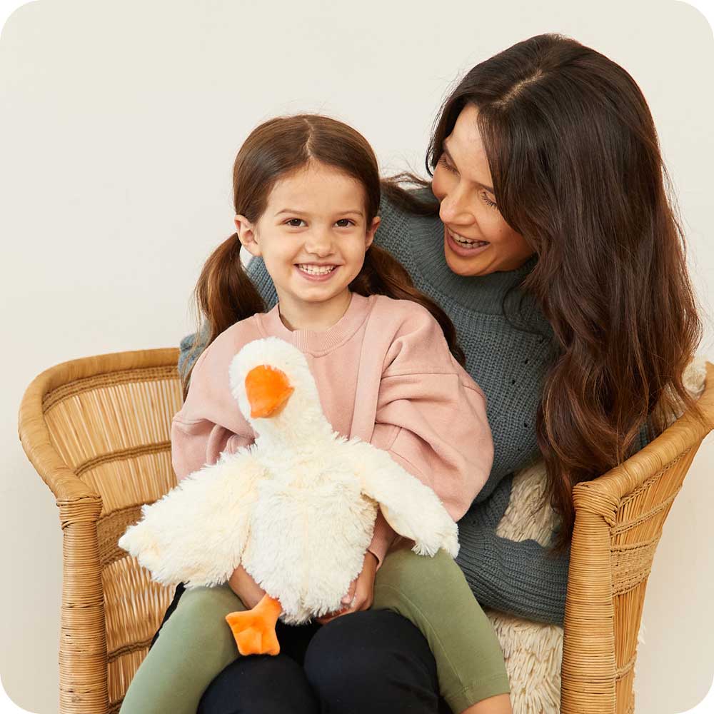 Mother and daughter sitting with Soft Warm Weighted Goose Plush Warmies