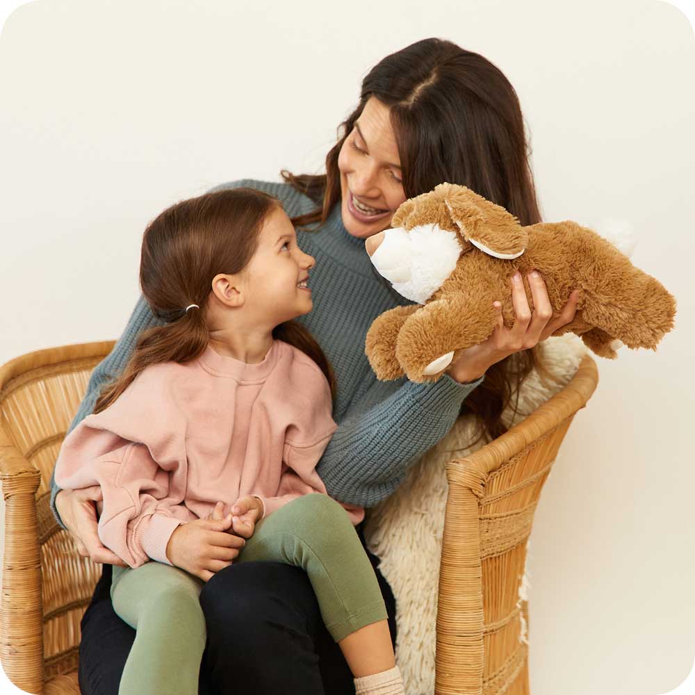 Mother and daughter playing with Cute Weighted Lavender Scented Brown Bunny Stuffed Animal Heating Pad Warmies