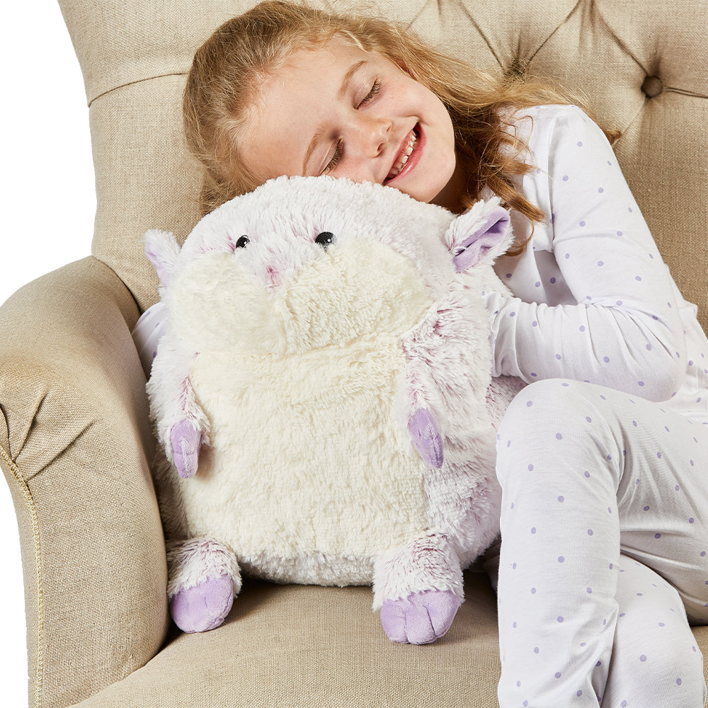 Girl cuddling Microwavable Supersized Hamster Warmies - Warmies USA