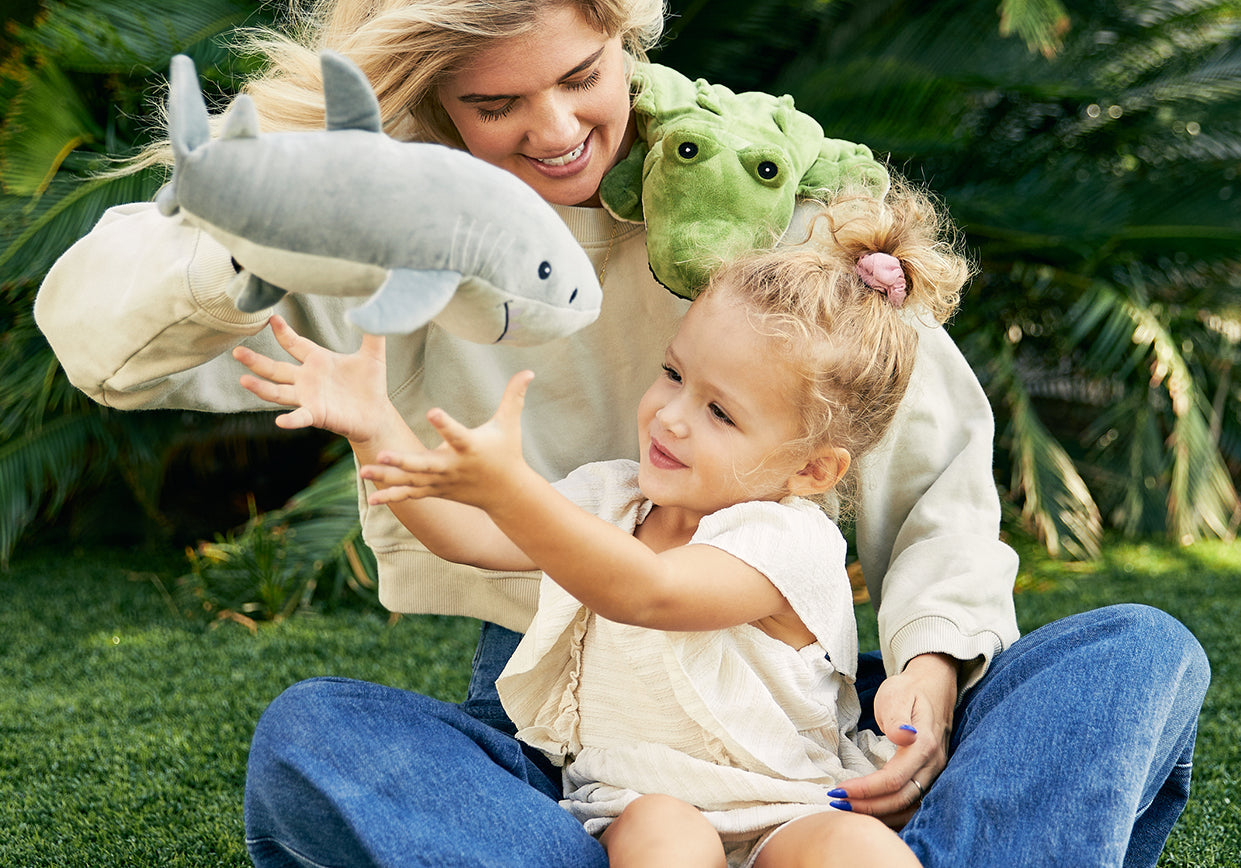 Joyful Child Embracing their Favorite Shark Toy.