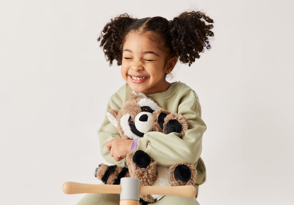Heatable Warmies raccoon plush toys.