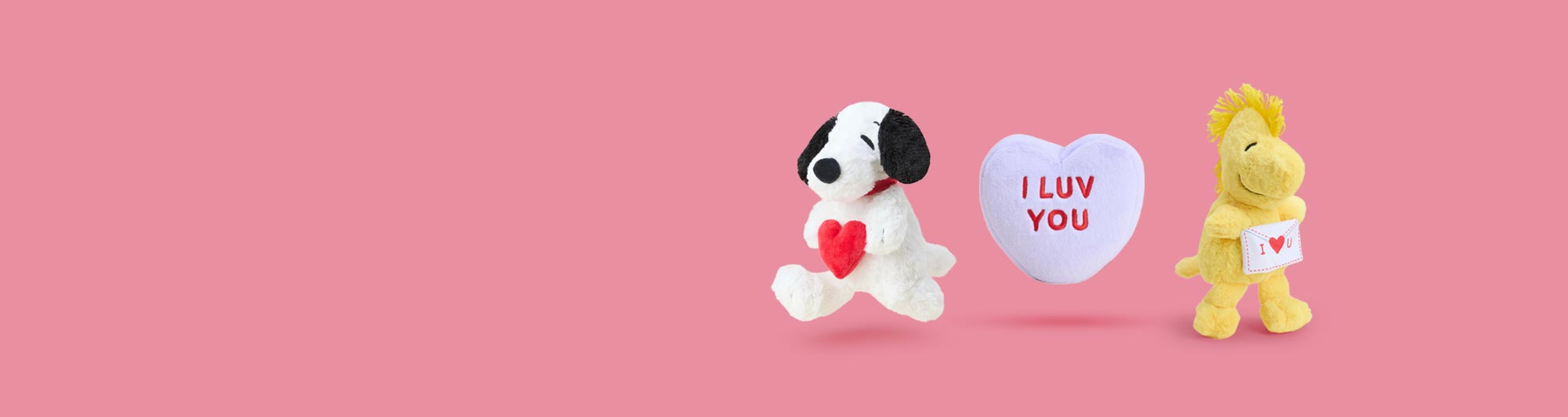 Warmies blue flower pot, Warmies yellow flower pot, Warmies orange flower pot, and Warmies green macaron sitting in a group.