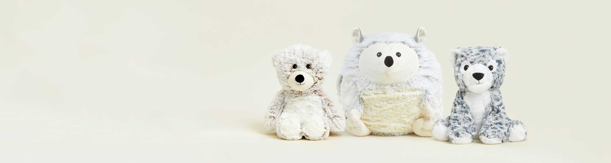 Marshmallow Bear, Supersized Hedgehog, and Snow leopard Warmies sitting in a row.