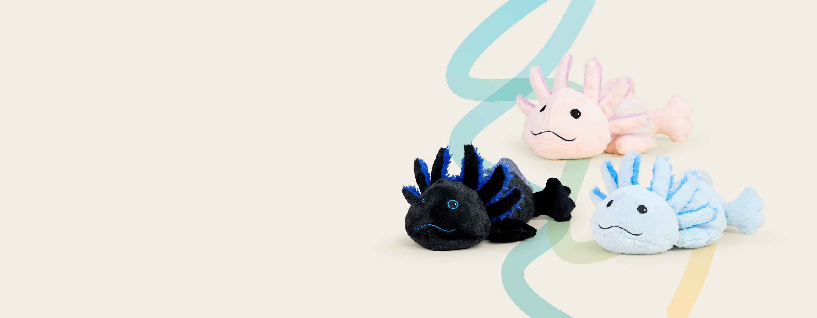 Black Axolotl, Blue Axolotl, Pink Axolotl Warmies sitting in a group agains a background with blue and yellow swirls.