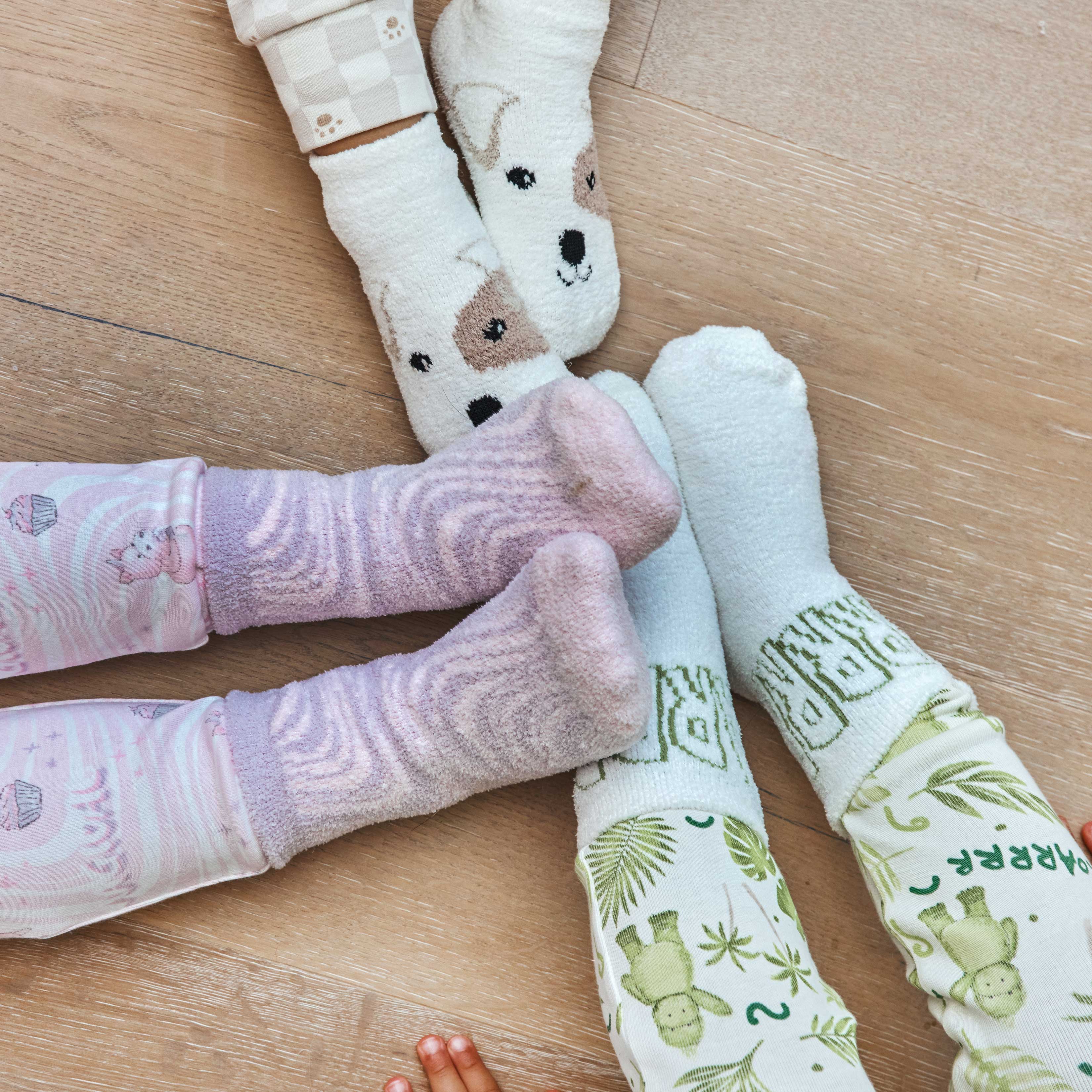 Warmies socks in various designs, showing cozy and playful patterns.