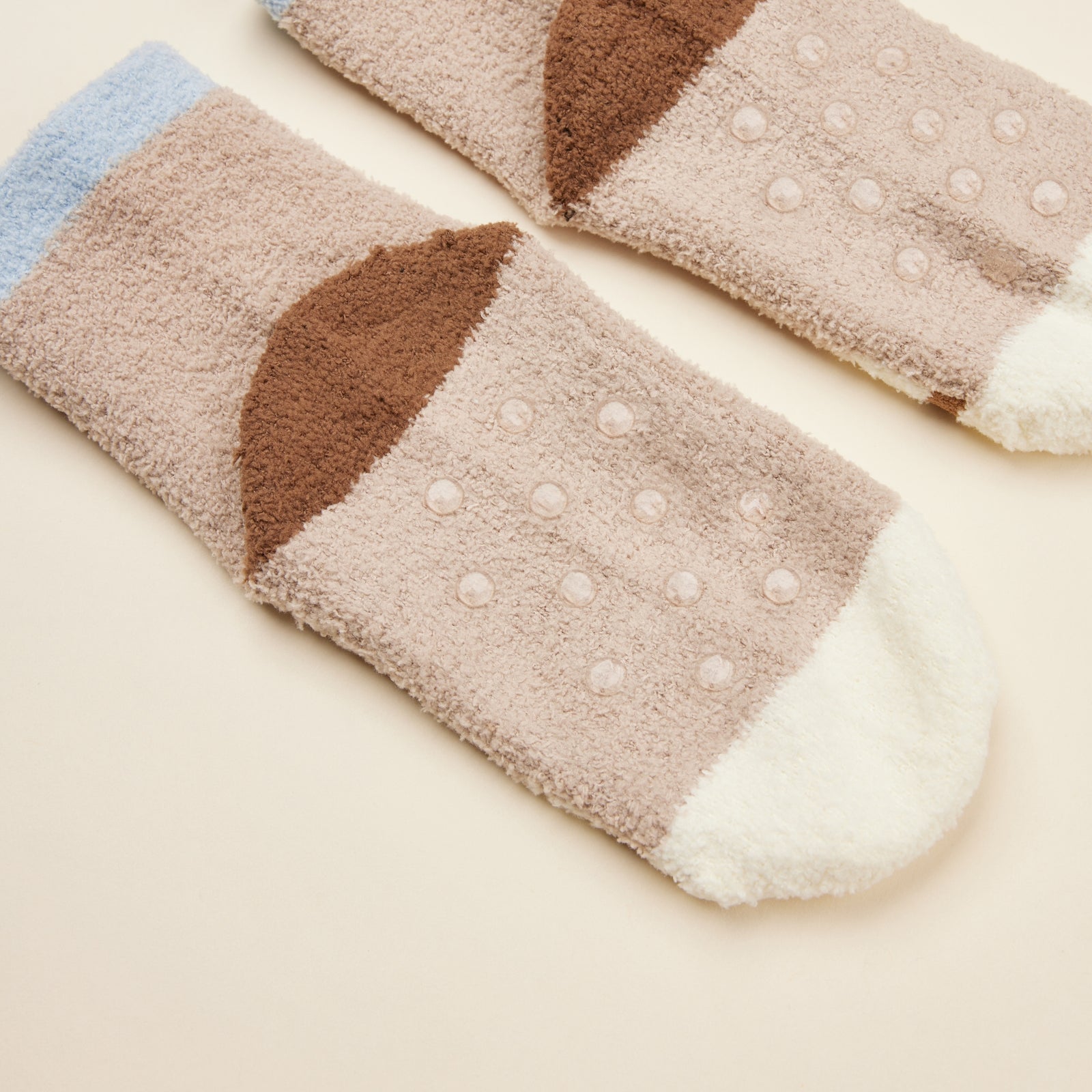 Close-up of Warmies socks with no-slip grip for secure footing.