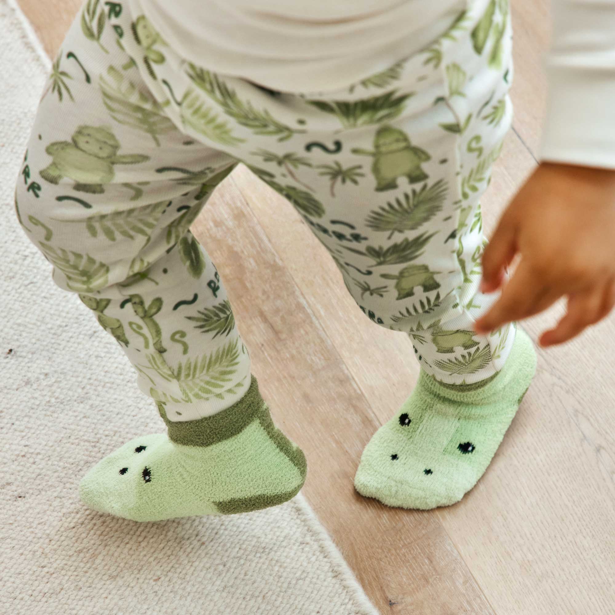 Child wearing Warmies socks providing cozy comfort.