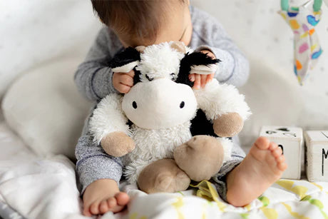 Child with a Black and White Cow Warmie