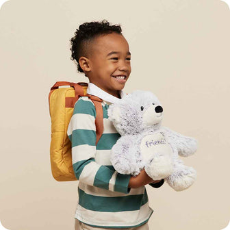 Little boy holding Cute Weighted Lavender Scented Friends Bear Stuffed Animal Heating Pad Warmies 