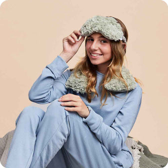 Teen smiling while wearing Lavender Scented Microwavable Curly Sage Green Warmies Neck Wrap