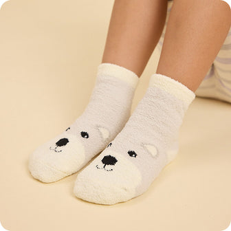 close up bear socks on feet