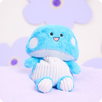 blue mushroom stuffed animal warmies on purple background
