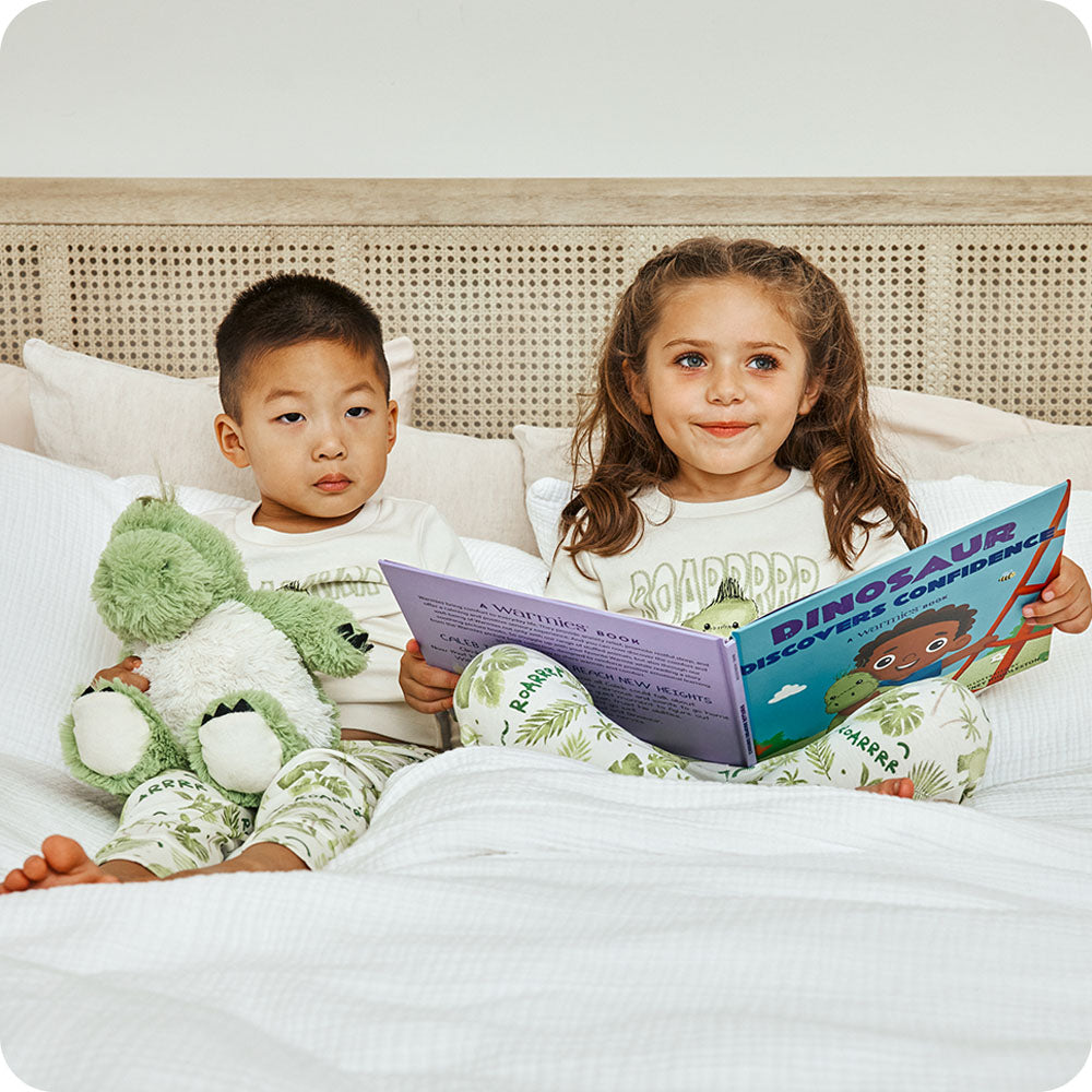 boy and girl reading Warmies Dinosaur Discovers Confidence book