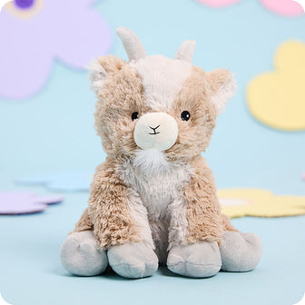 goat stuffed animal warmies on blue background