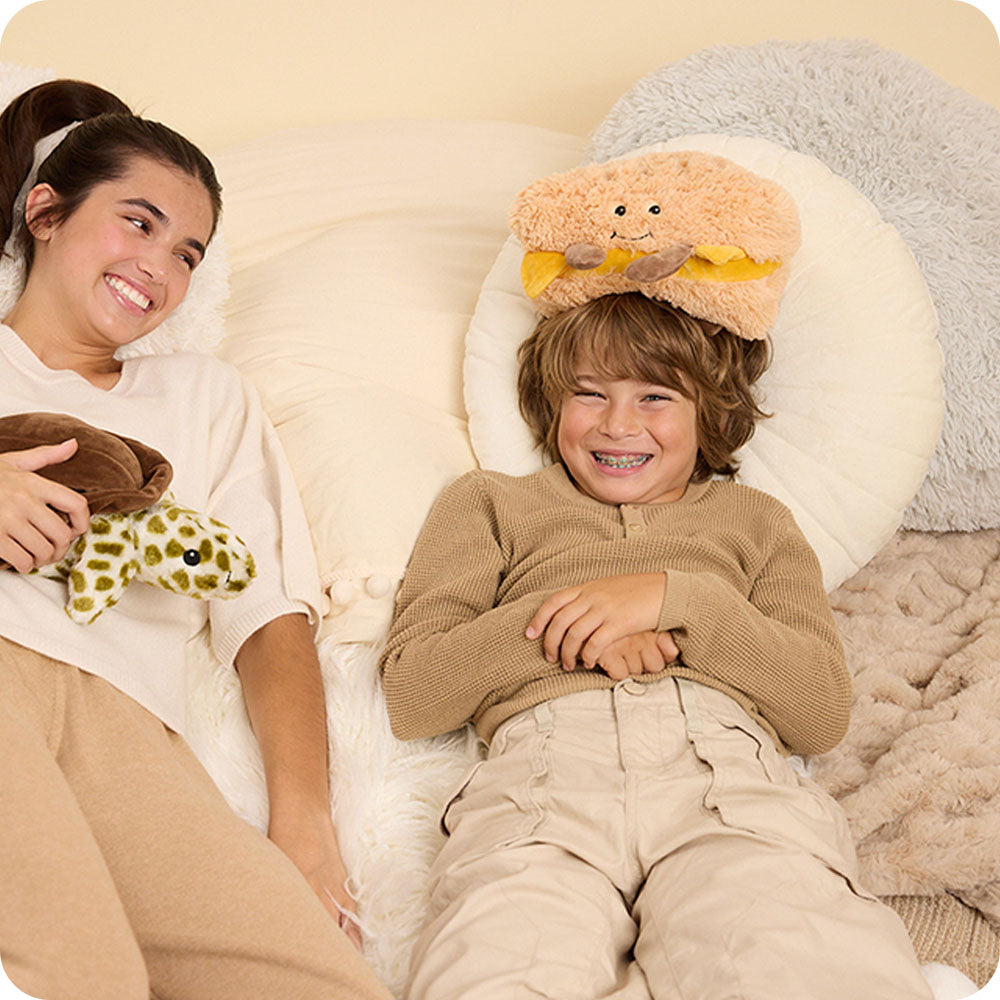 boy with a grilled cheese stuffed animal warmies on his head
