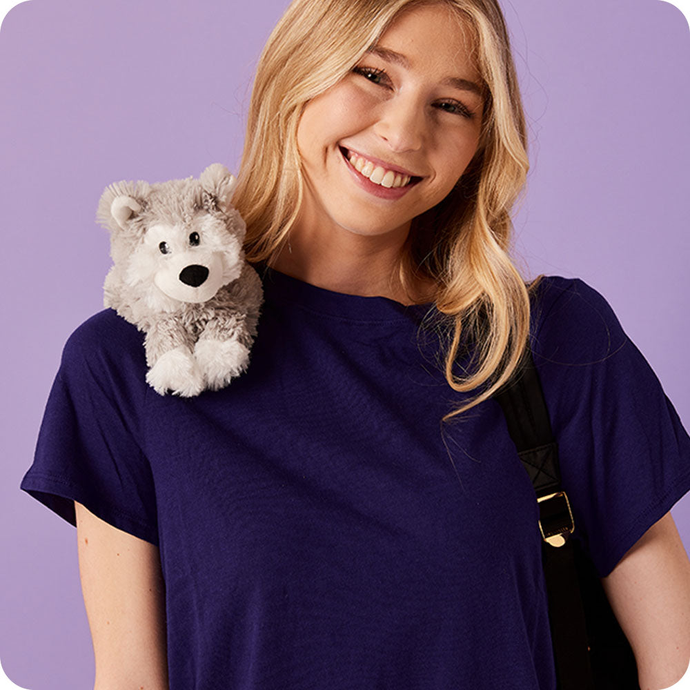 girl with husky stuffed animal on her shoulder