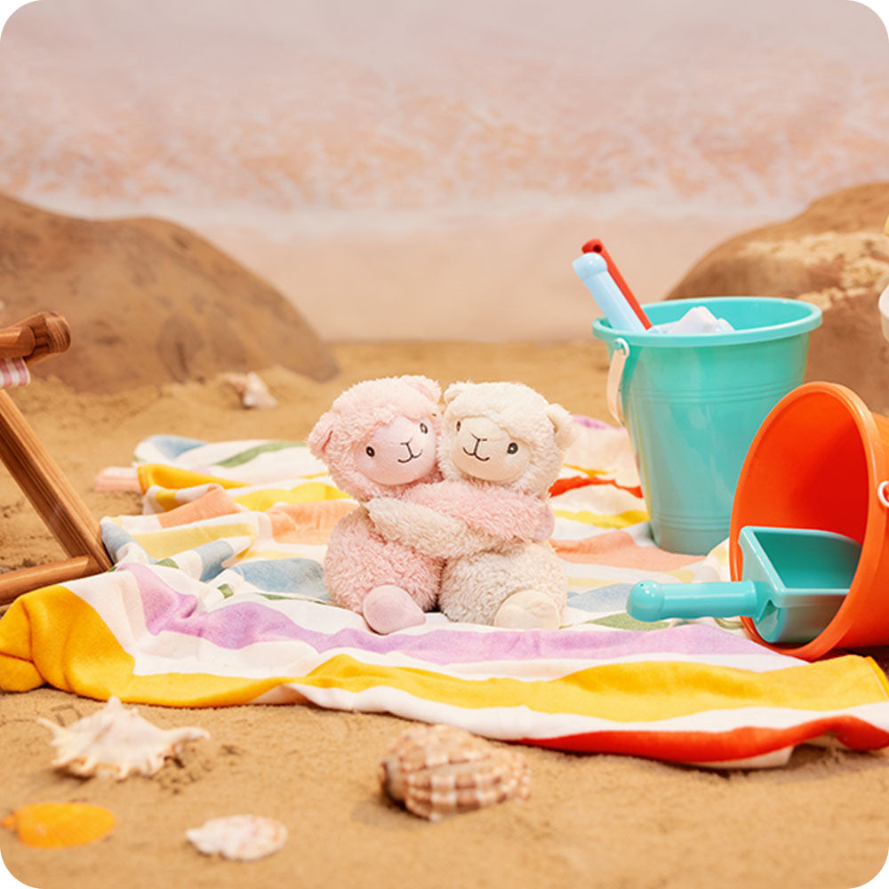 llama hugs stuffed animal warmies at the beach