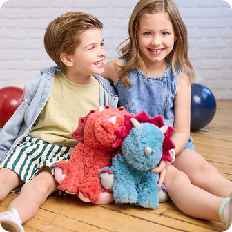kids playing with triceratops stuffed animal warmies